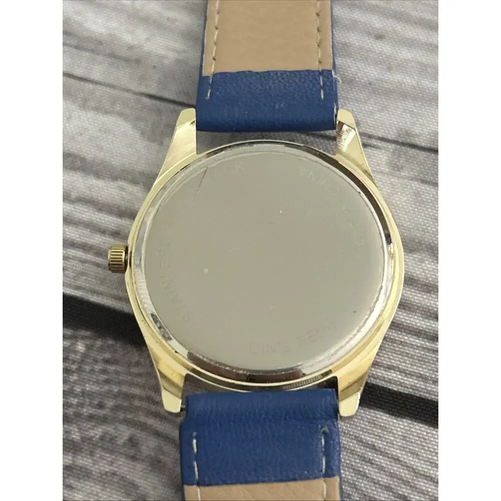 Gold Tone Case Purple Dial Blue Band Women’s Quartz Watch